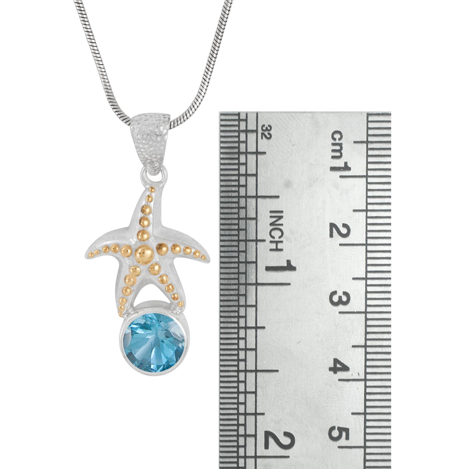 Silver Silver Pendant With Star Fist Component, Blue Topaz Facet