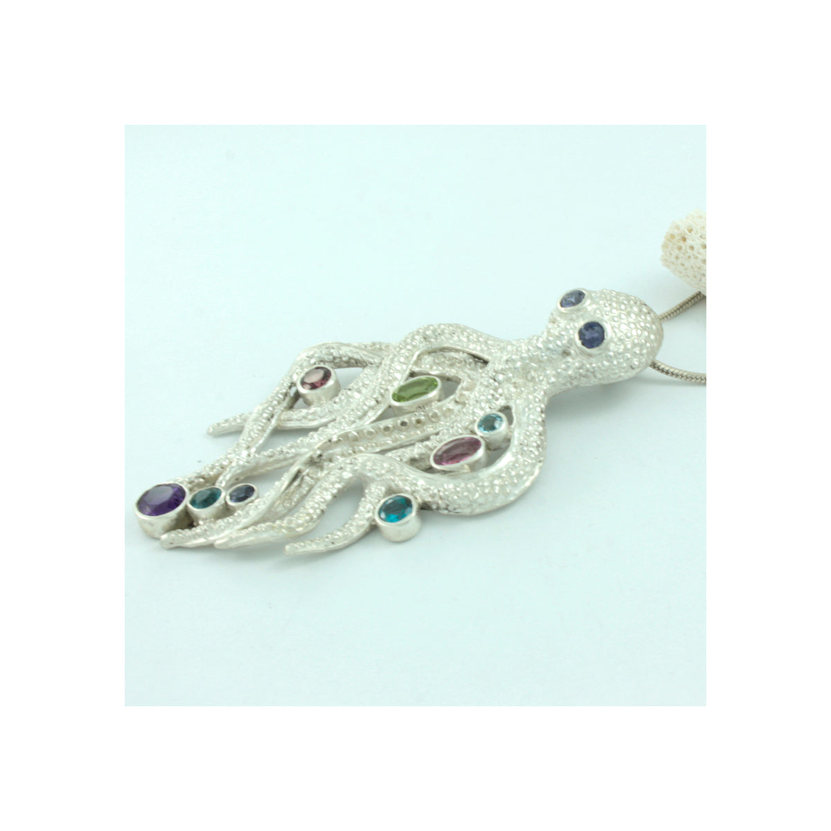 Silver Pendant With Octopus Component With Multi Facet Stone